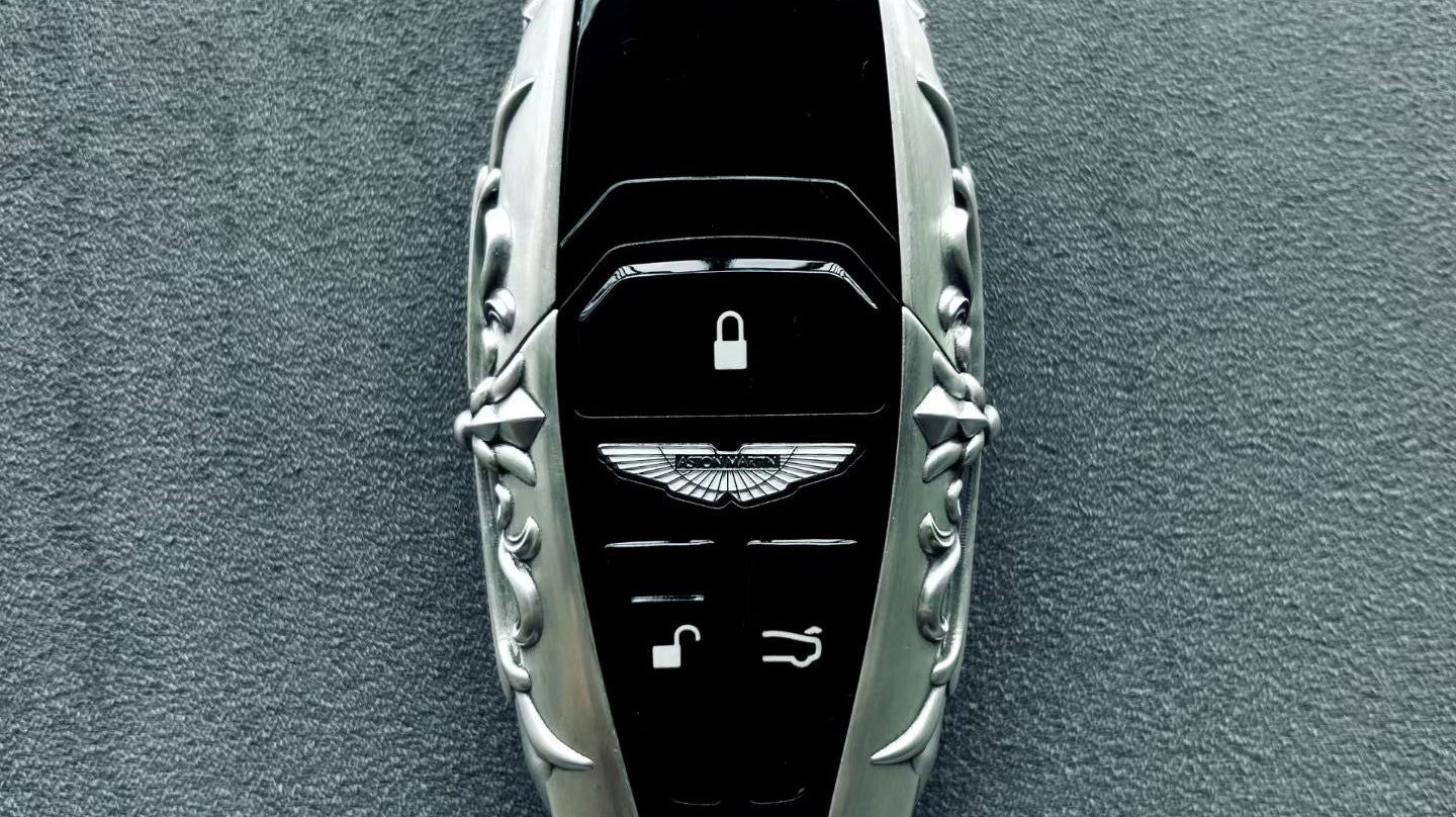 Back view of handcrafted sterling silver key case showing scrollwork and material depth