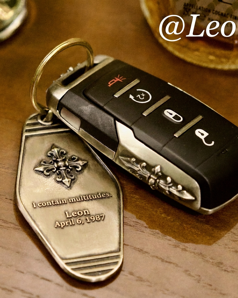 Custom name and date engraving example on a metal key tag