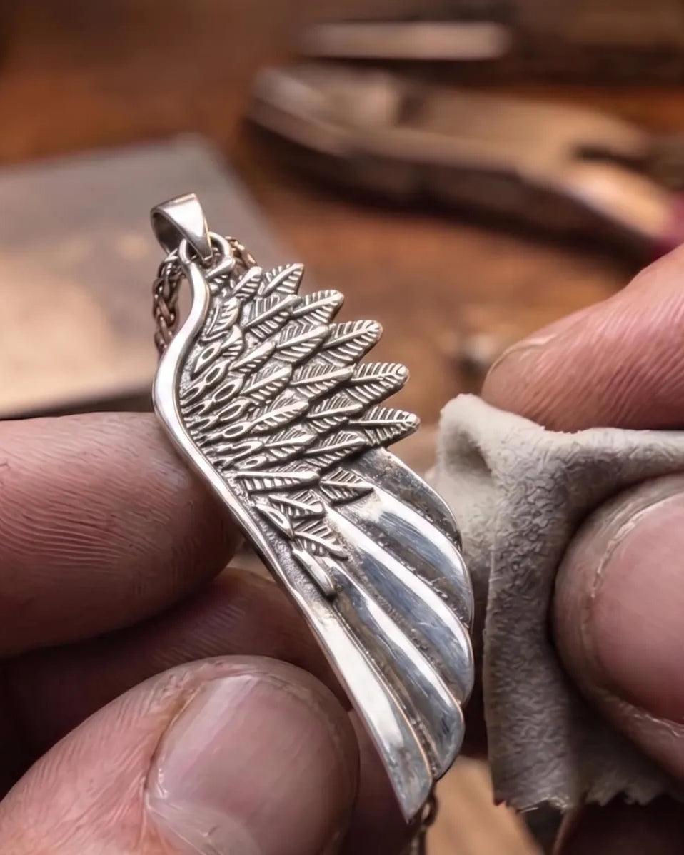 Angel Wing 925 Silver Pendant, displayed on a dark surface