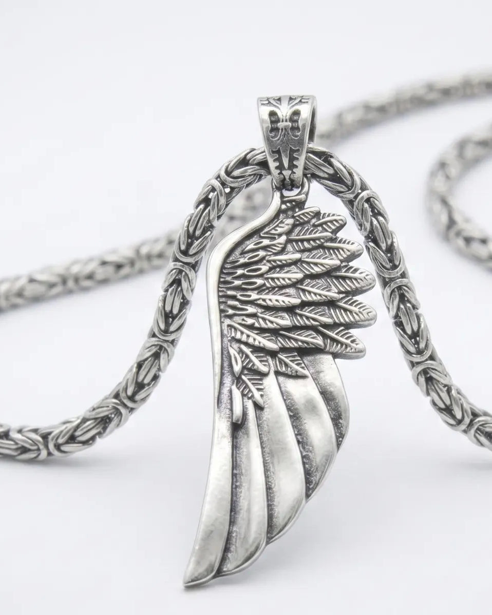 Angel Wing 925 Silver Pendant, held for scale
