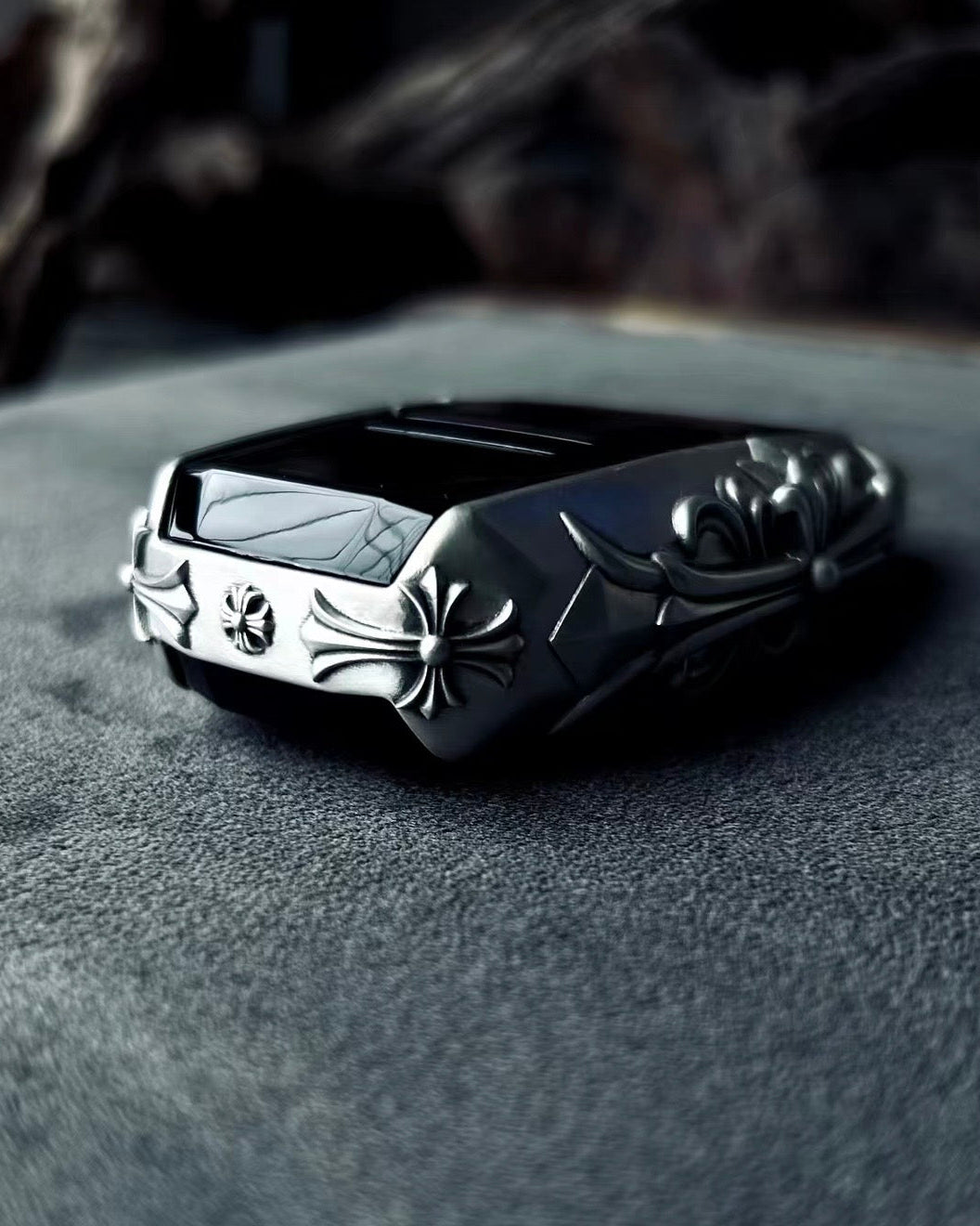 Aston Martin handcrafted sterling silver key case top-down view showcasing streamlined silhouette, solid silver edge engraving and precise fit for original key fob
