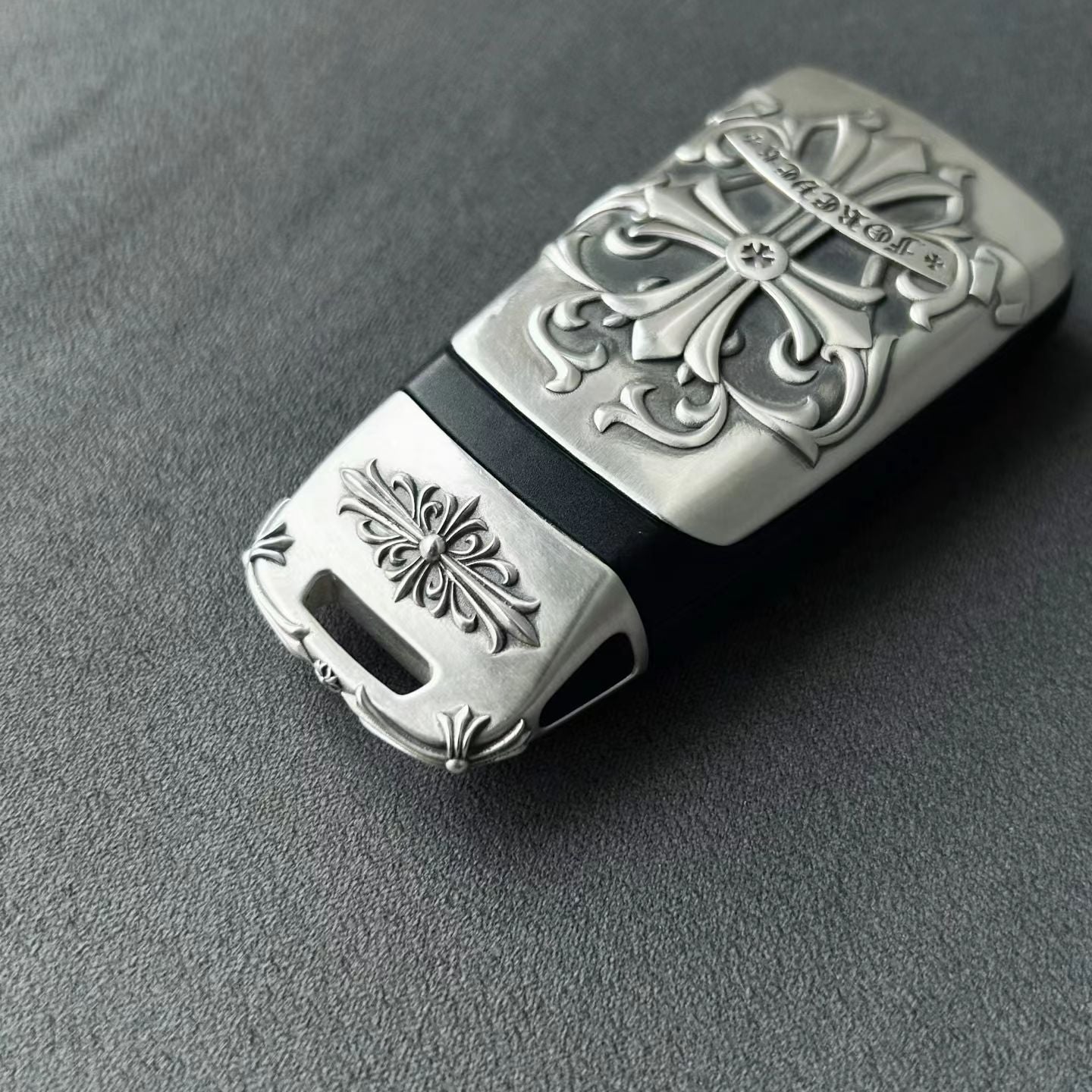 Precision engraved Audi four rings logo on handmade silver key case bottom detail