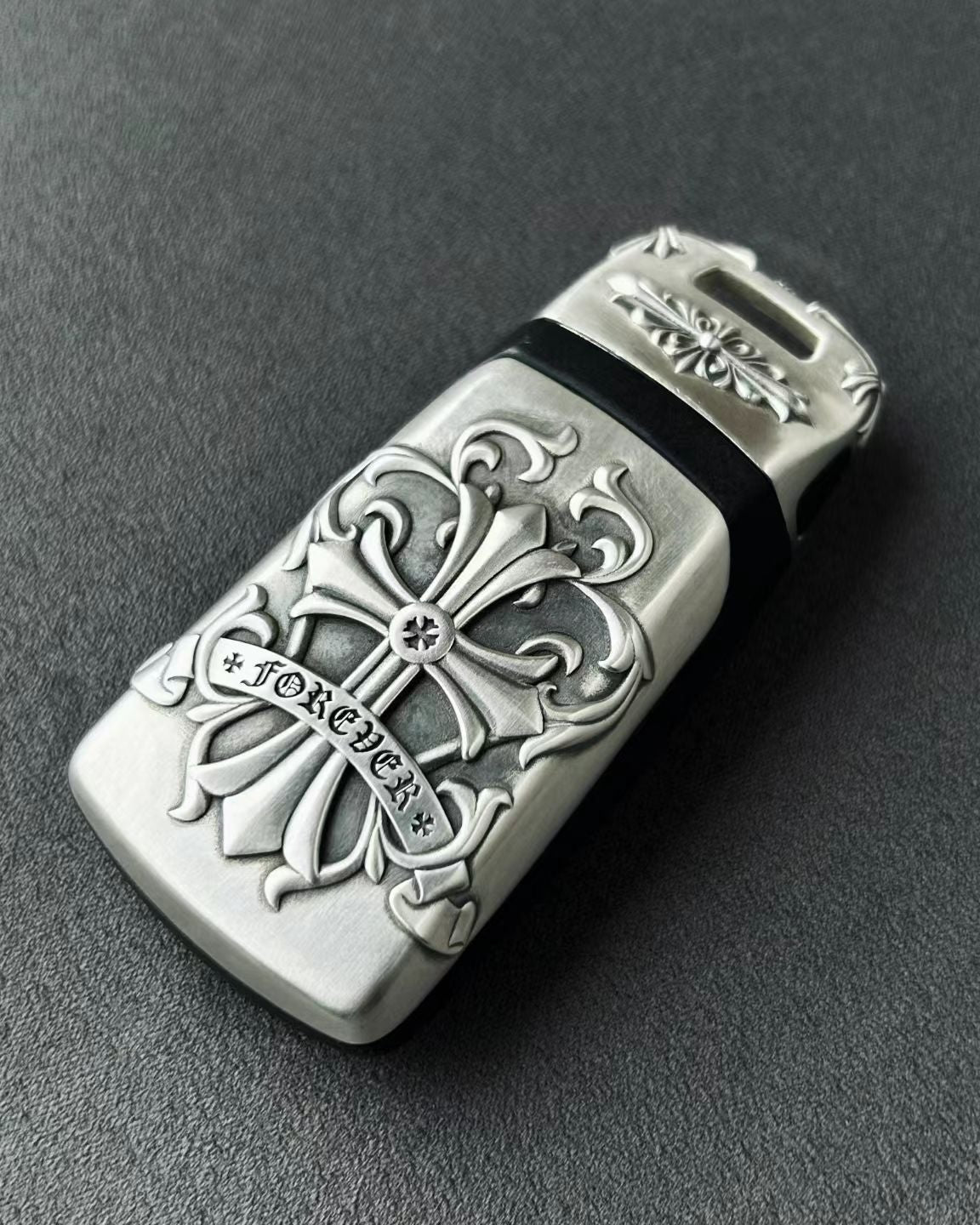 Understated luxury Audi key case flat lay presentation showcasing intentional weight and density