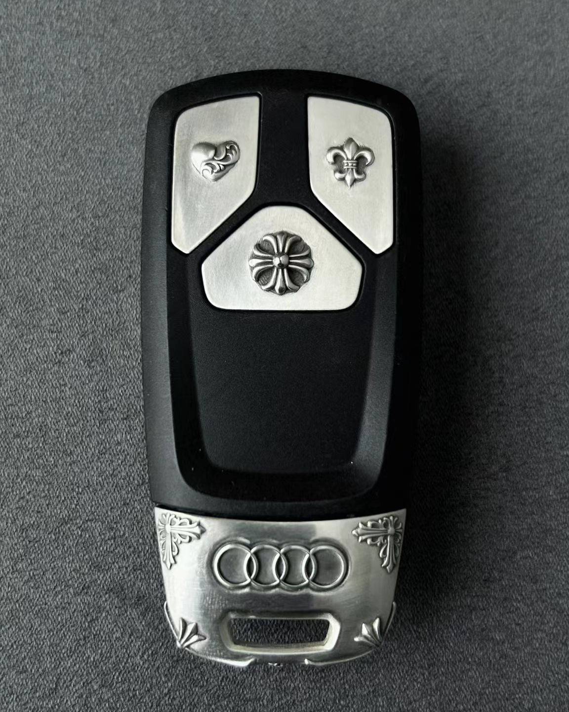 Audi Tri-Layout handcrafted key case Nickel Silver front view with precision engraved details