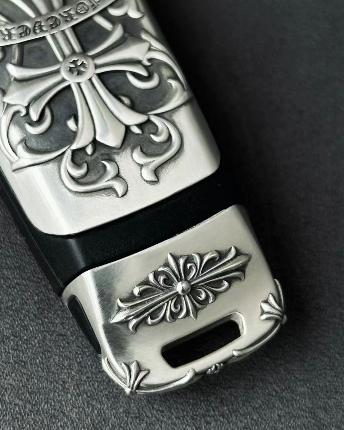 Hand-finished cross pattern detail on Audi tri-layout key case top view craftsmanship