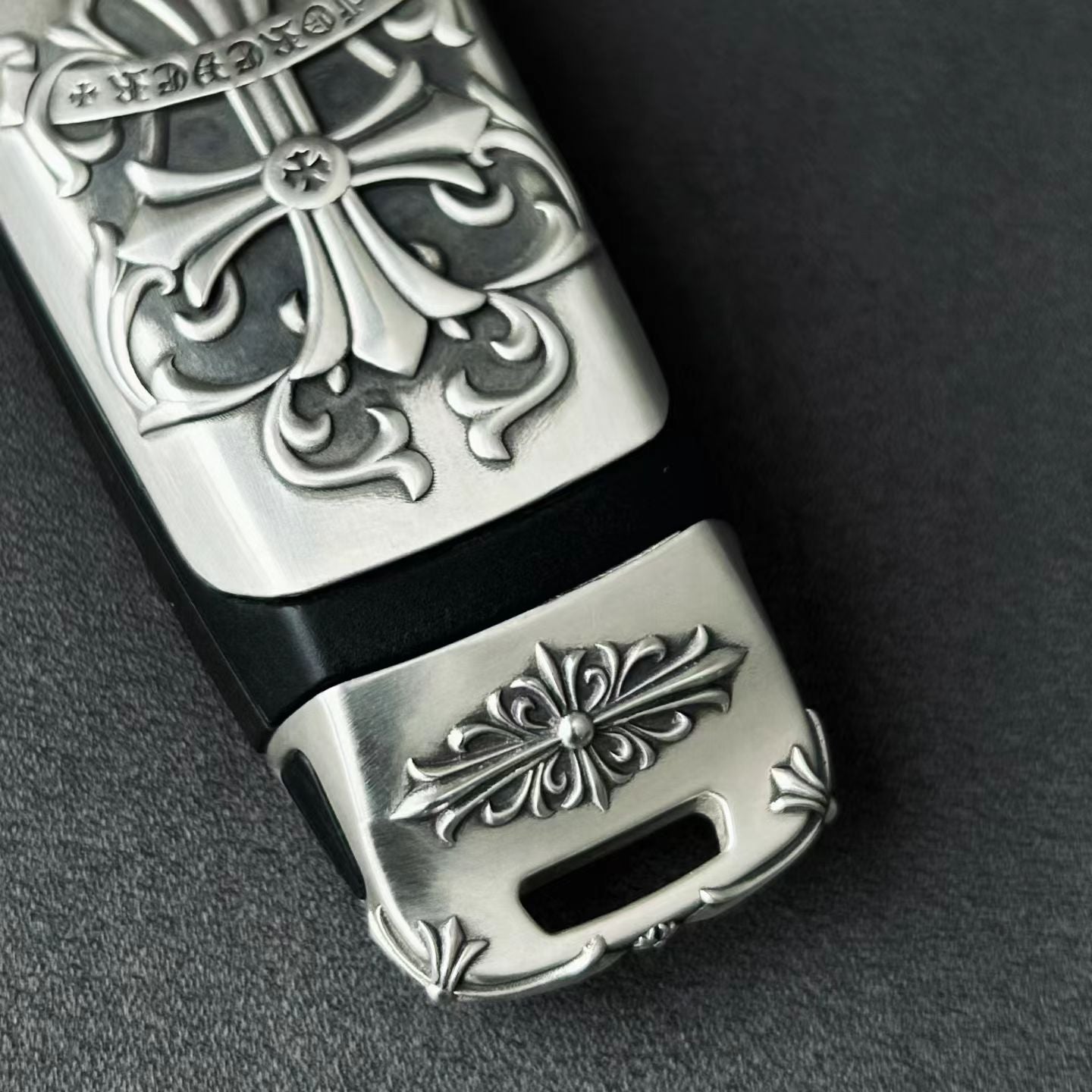 Hand-finished cross pattern detail on Audi tri-layout key case top view craftsmanship