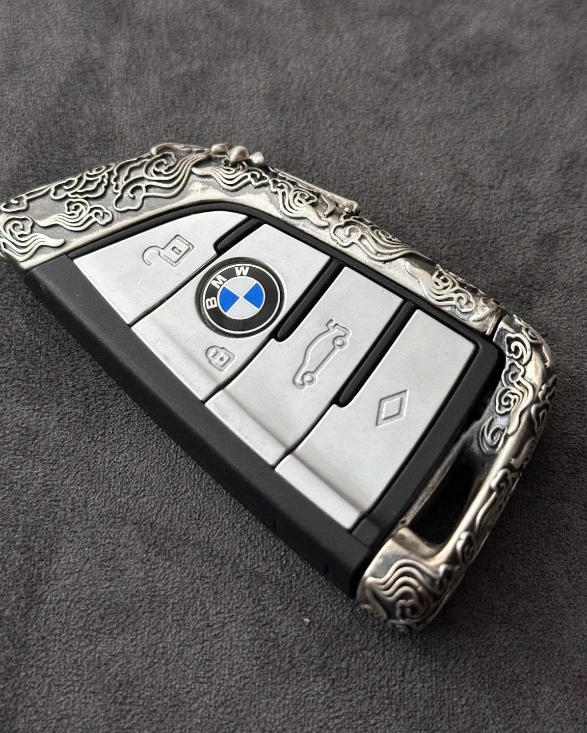 BMW E90 key case in 925 sterling silver with cloud style ultra-matte finish and hand-engraved border, designed for 2006-2014 3-series sedans