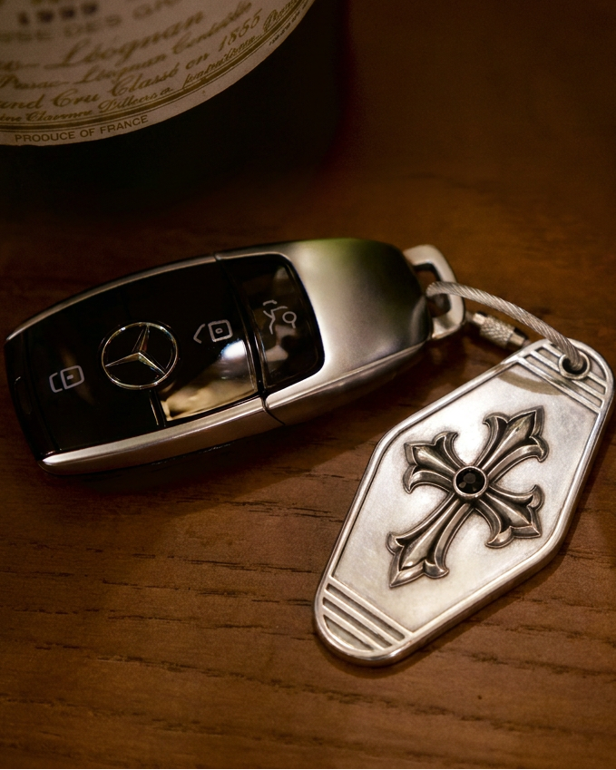 Cathedral Cross Sterling Silver Keychain, front view beside a car key