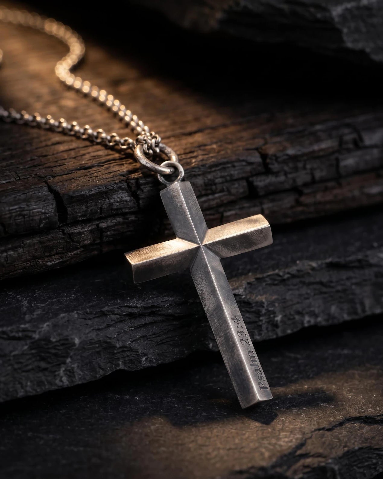 Custom Engraved 925 Silver Cross Pendant, front view beside a car key