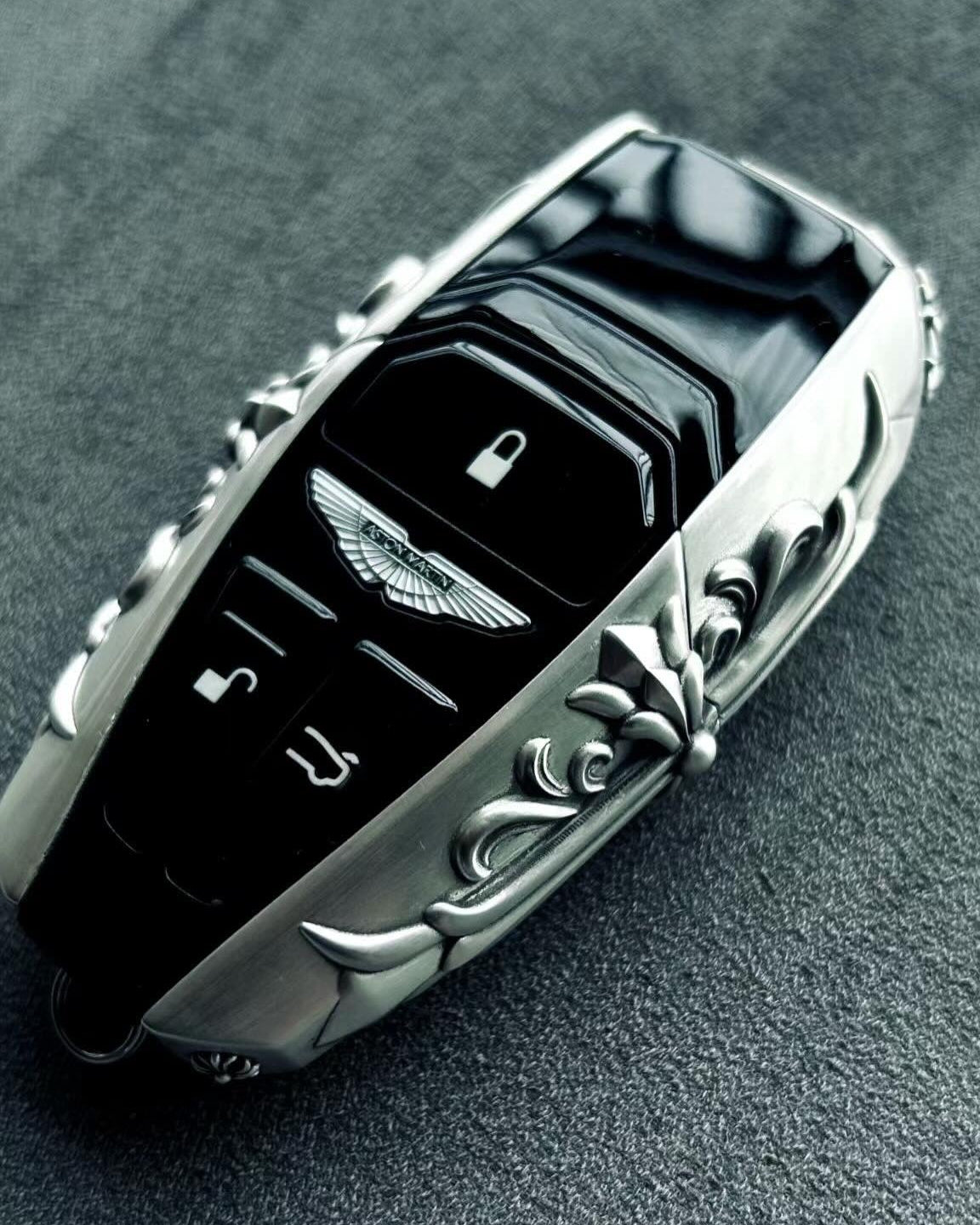 Bespoke 925 Sterling Silver key shell featuring intentional scrollwork engraving, hand-finished surface with refined patina, precision fit guarantee