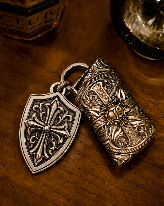 Engraved shield keychain grouped with other handcrafted key accessories