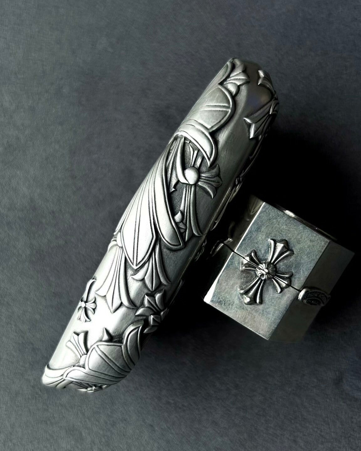 Close-up of intricate faceted blade engraving on handcrafted solid silver surface