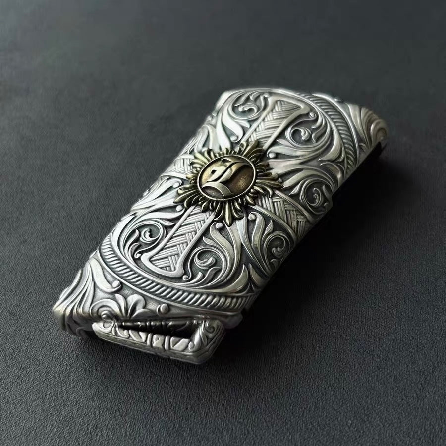 Angled view of hand-finished sunburst emblem with Lexus key fob inserted