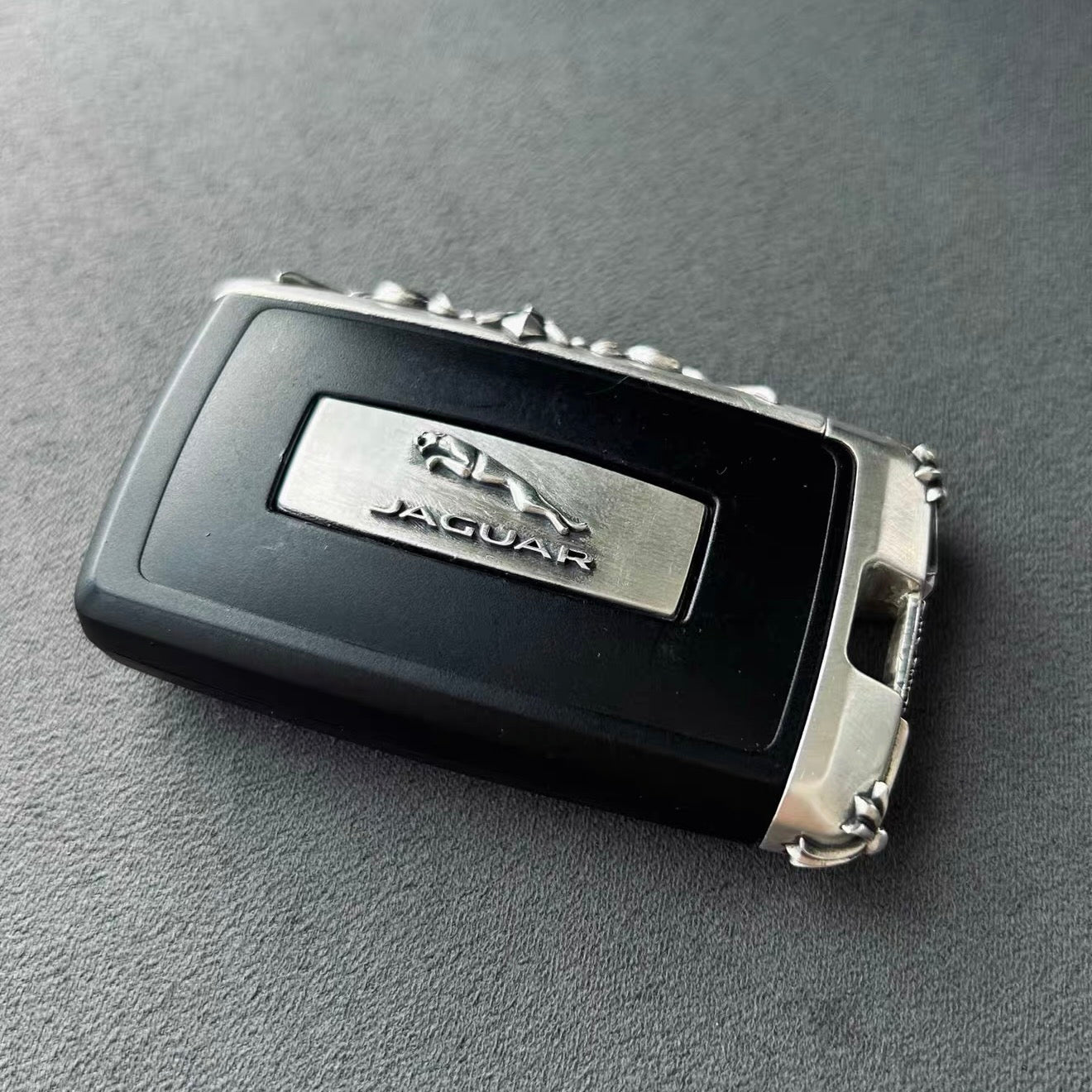 Handcrafted Jaguar Sterling Silver key case displayed with understated elegance