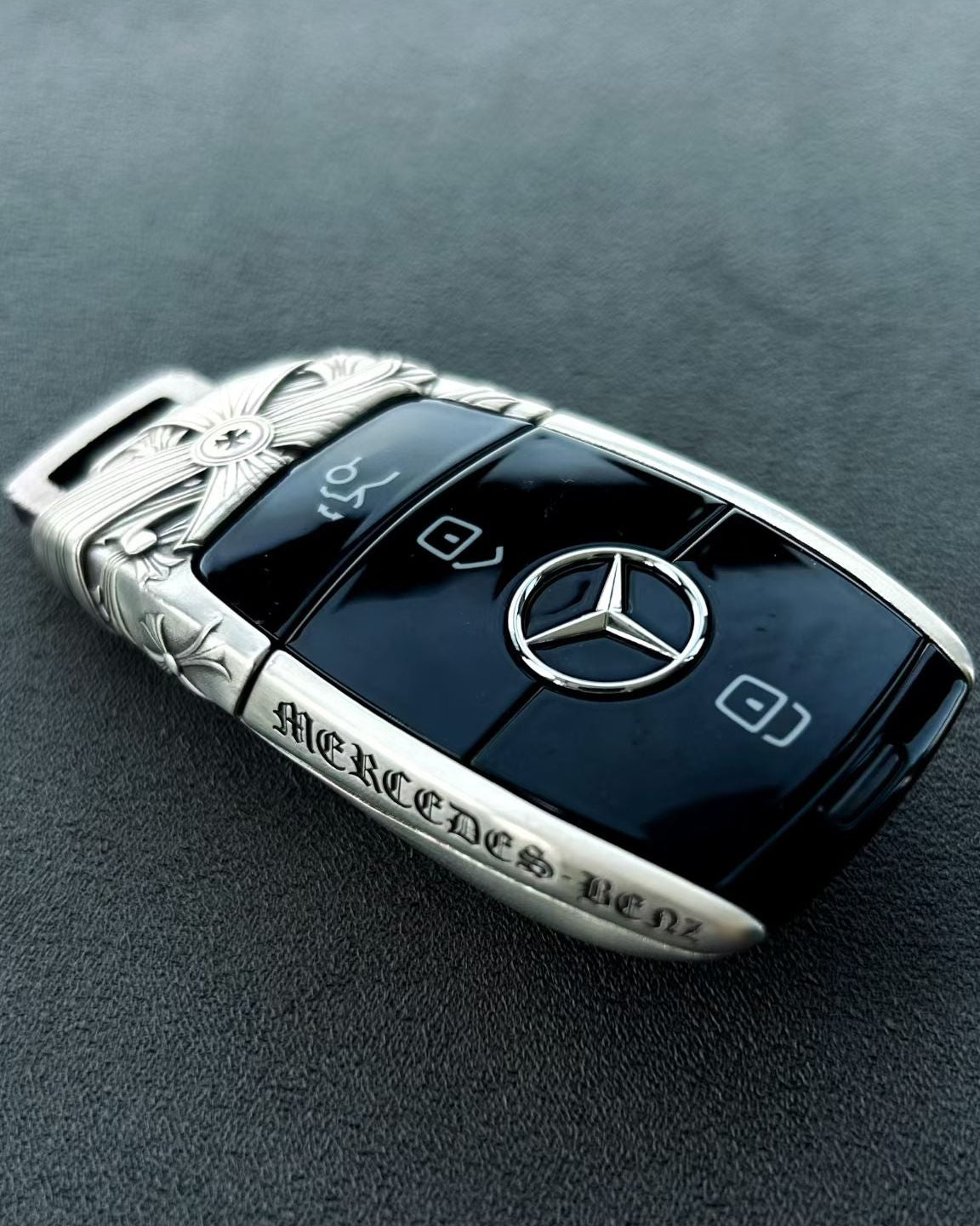 Handcrafted silver car key case, front engraving detail