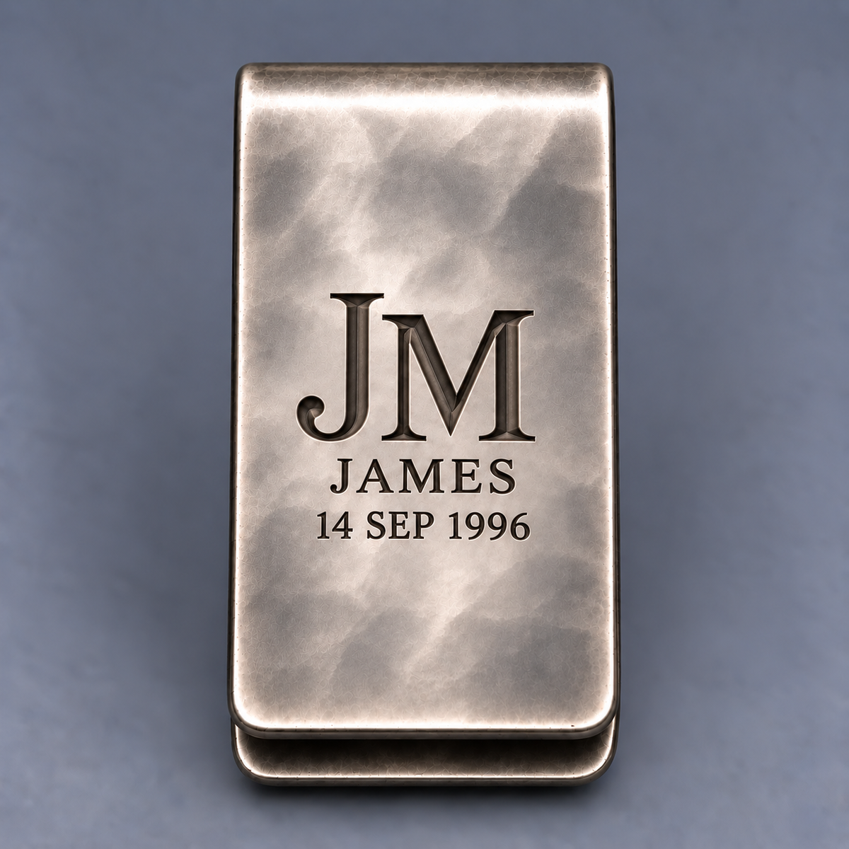 Front view of personalized money clip with deep JM monogram name and date engraving