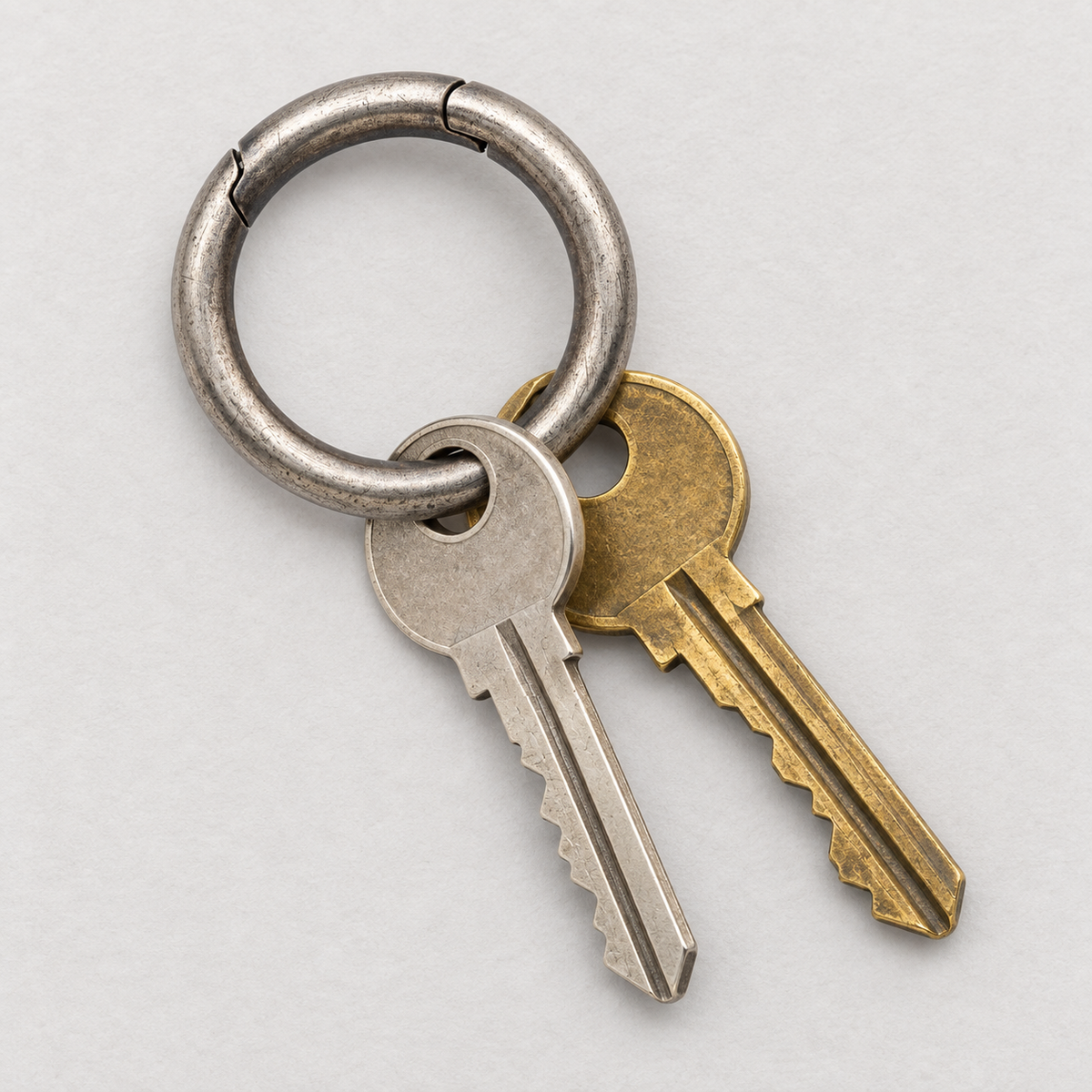 925 sterling silver spring-gate key ring holding two ordinary house keys; keys not included