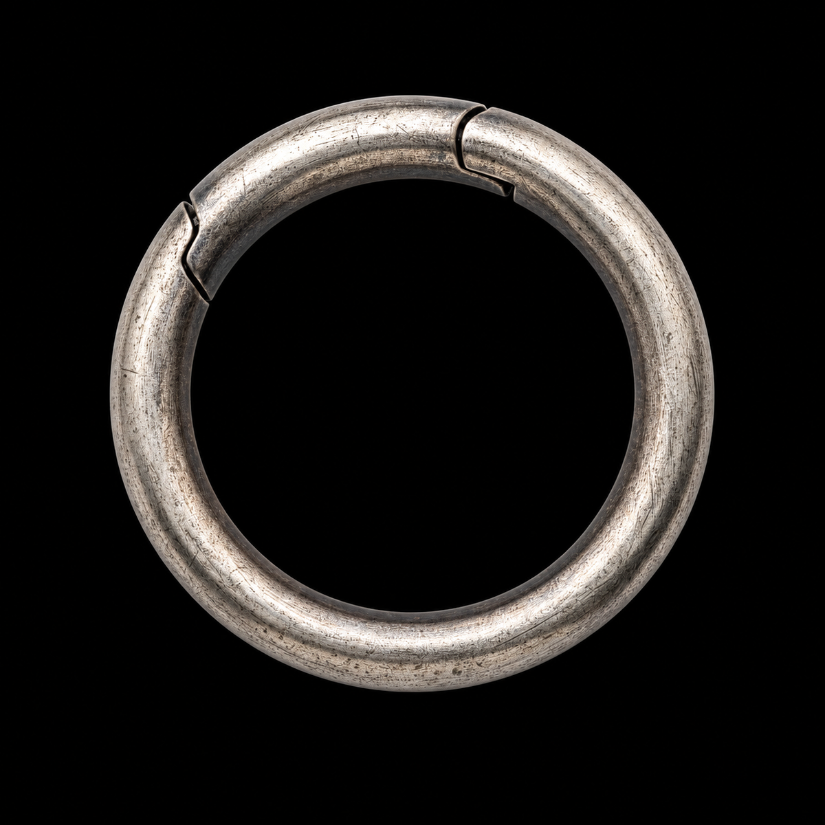 Unengraved 925 sterling silver spring-gate key ring on a black background