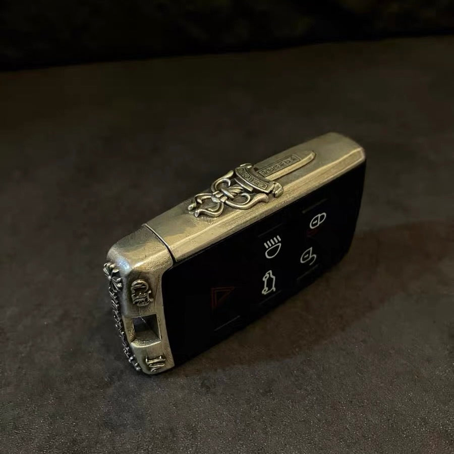 Close-up of the four-button layout on the Land Rover sterling silver case, preserving original functionality with precision cutouts.