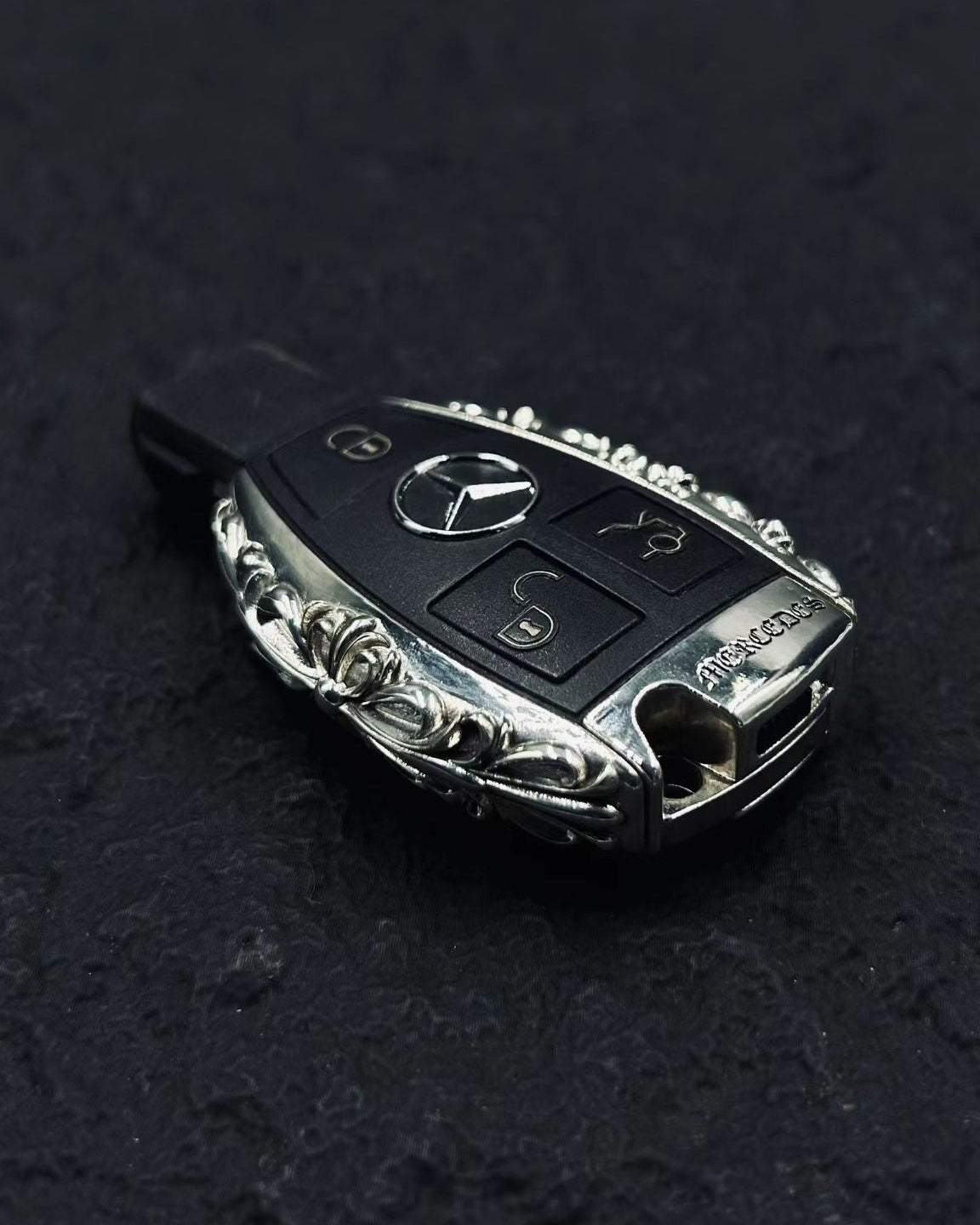 Handcrafted silver car key case, engraved detail