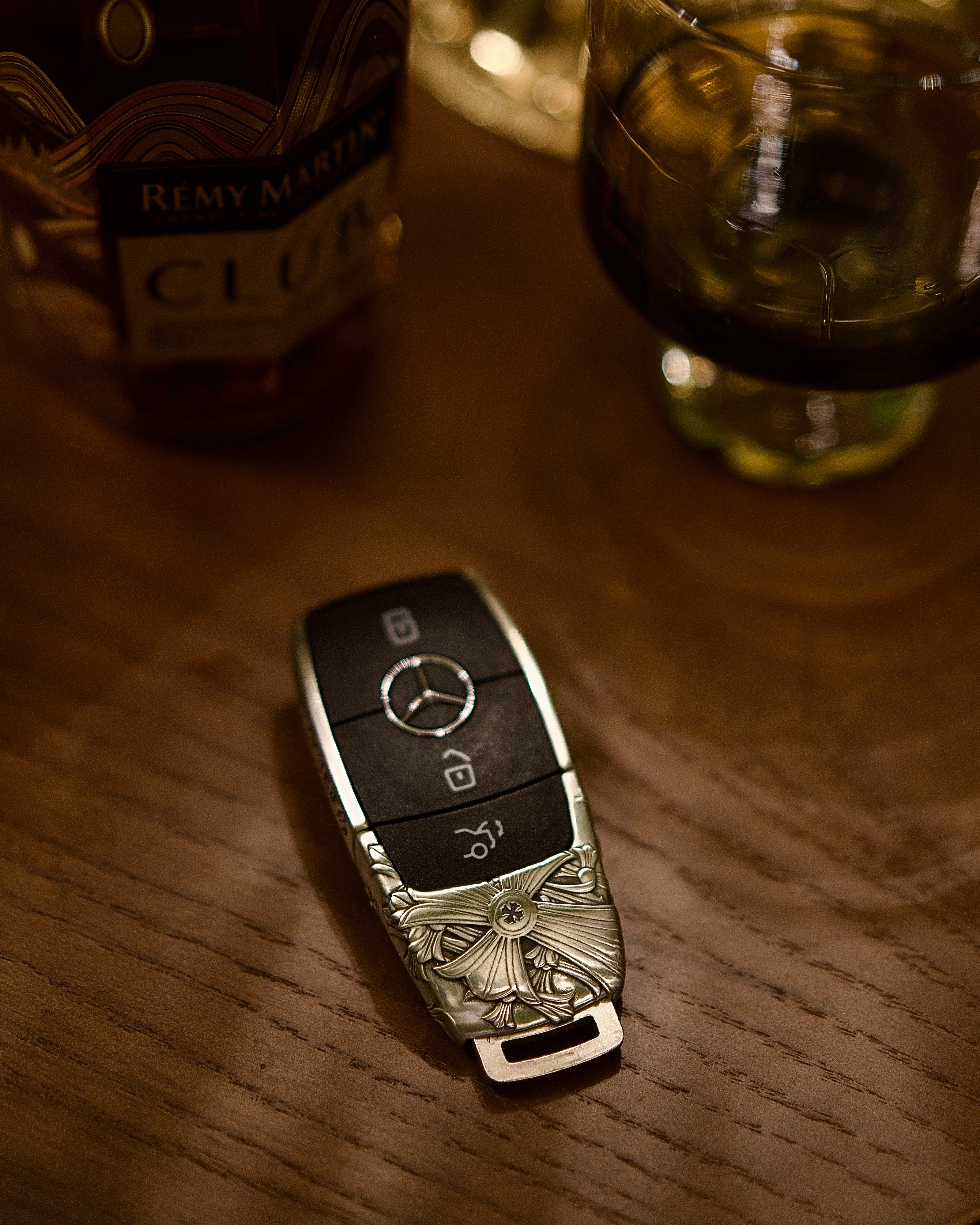 Mercedes key transformation before and after adding handcrafted silver case protection on wooden table showcasing refined finish and perfect fit