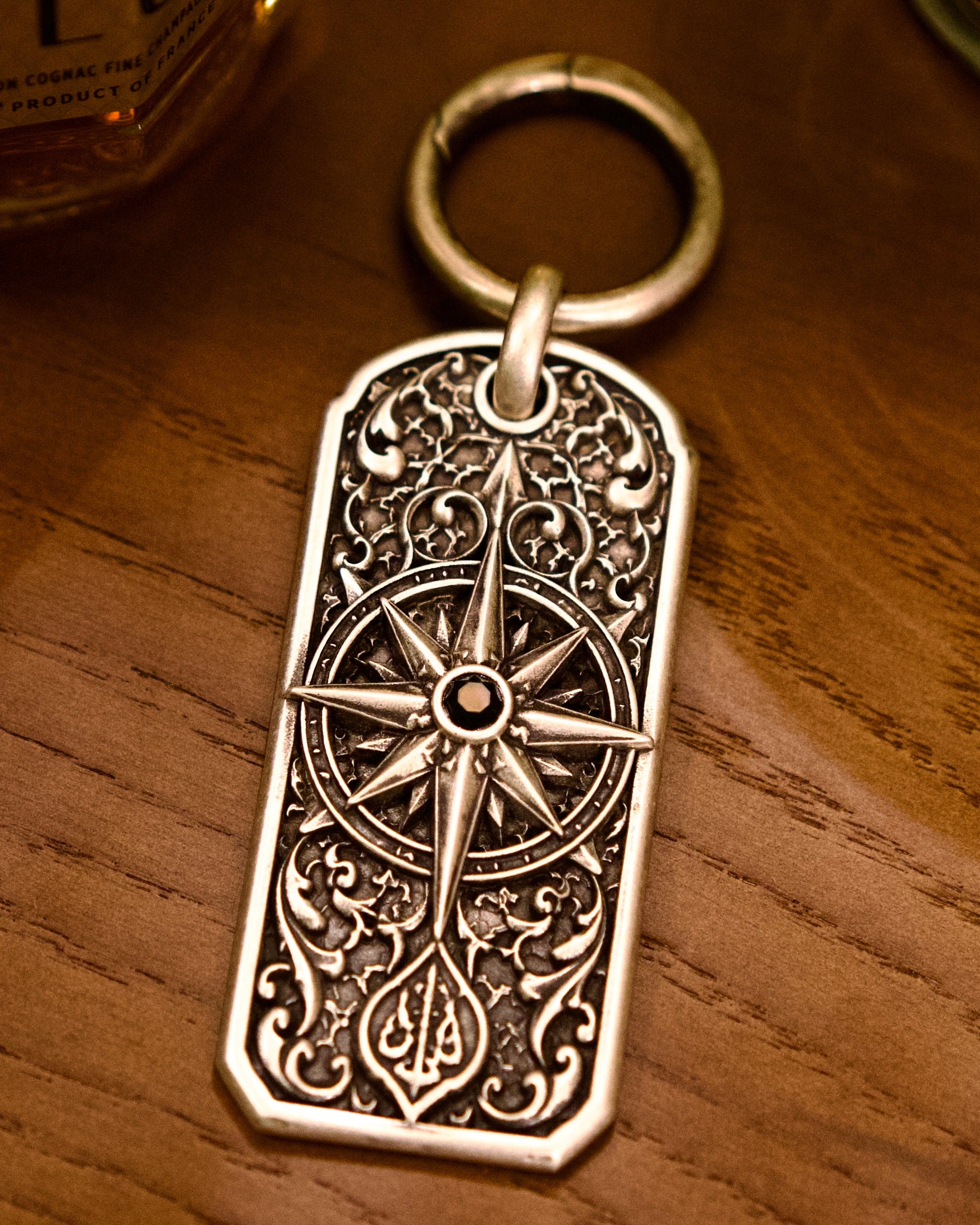 Meridian Heirloom Personalized Key Tag, front view beside a car key