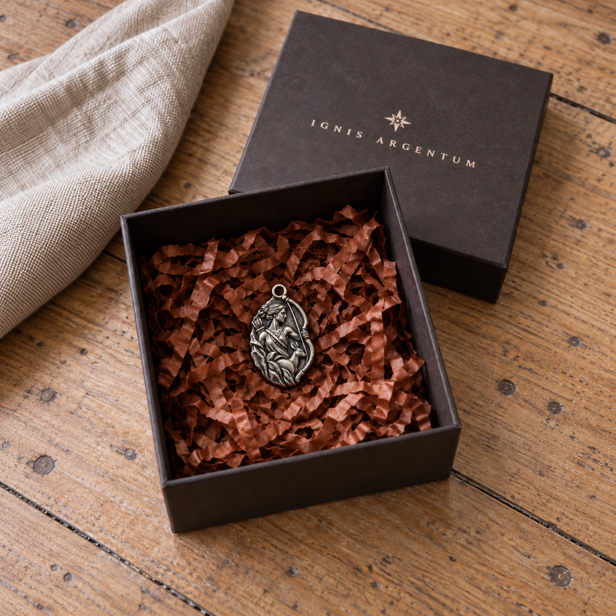 Artemis MYTHOS charm — IGNIS ARGENTUM gift box styling; design visualization