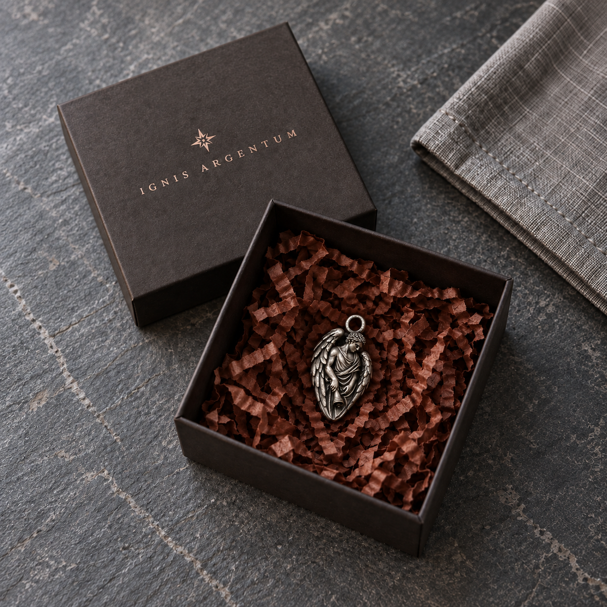 Thanatos MYTHOS charm — IGNIS ARGENTUM gift box styling; design visualization