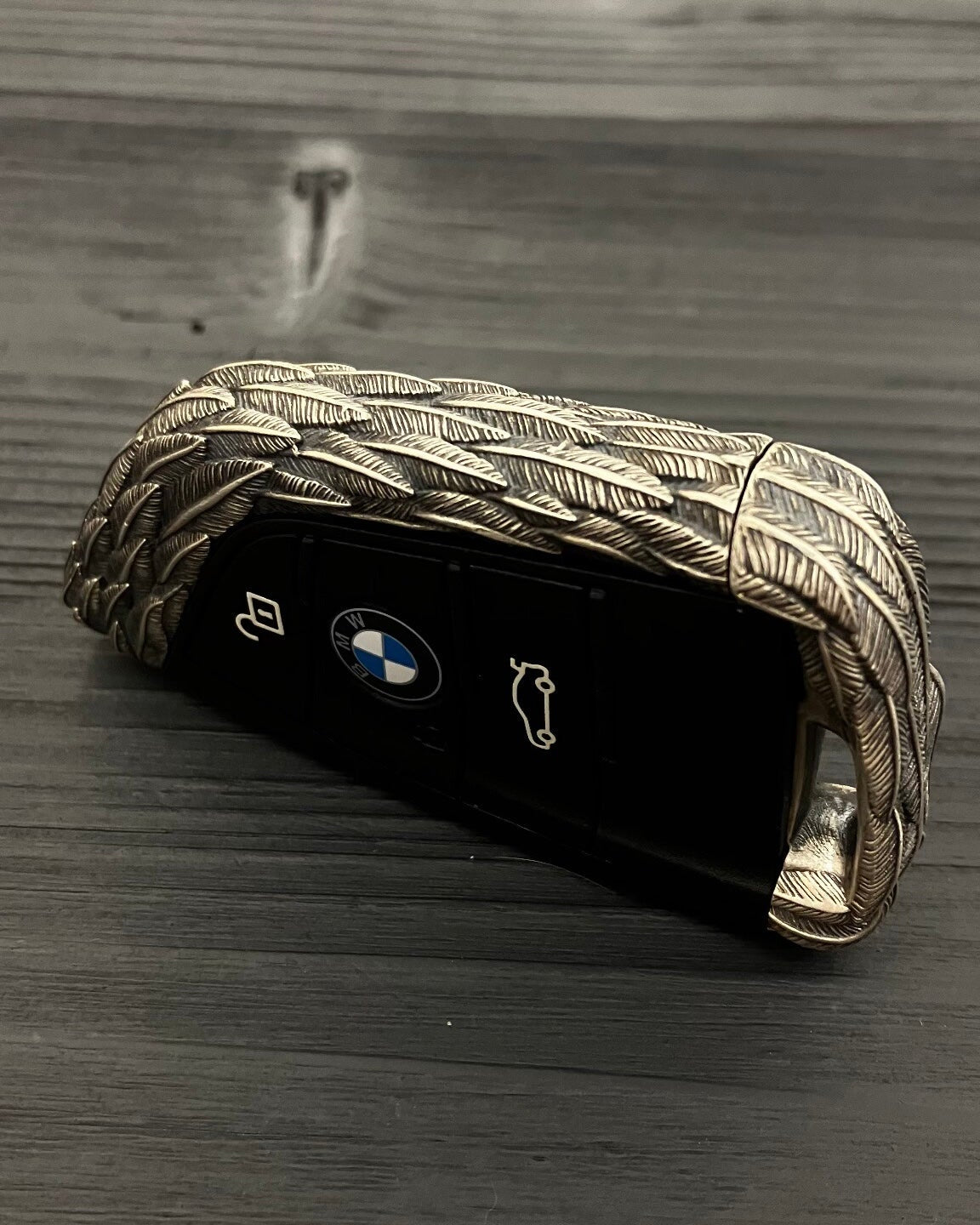 Three-button layout (lock/unlock/trunk) on handcrafted 925 Sterling Silver BMW key fob