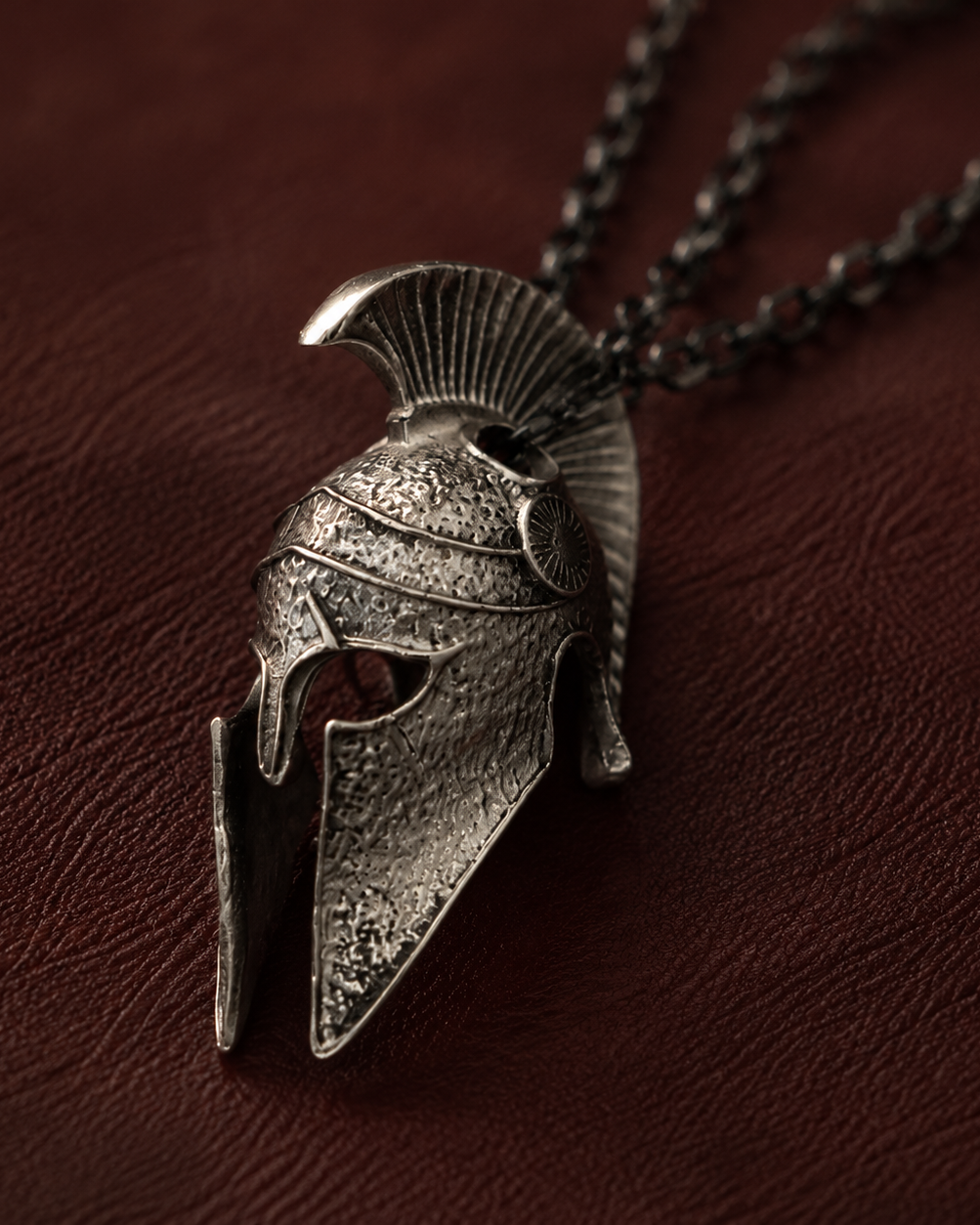 Spartan Helmet Talisman Pendant, displayed on a dark surface
