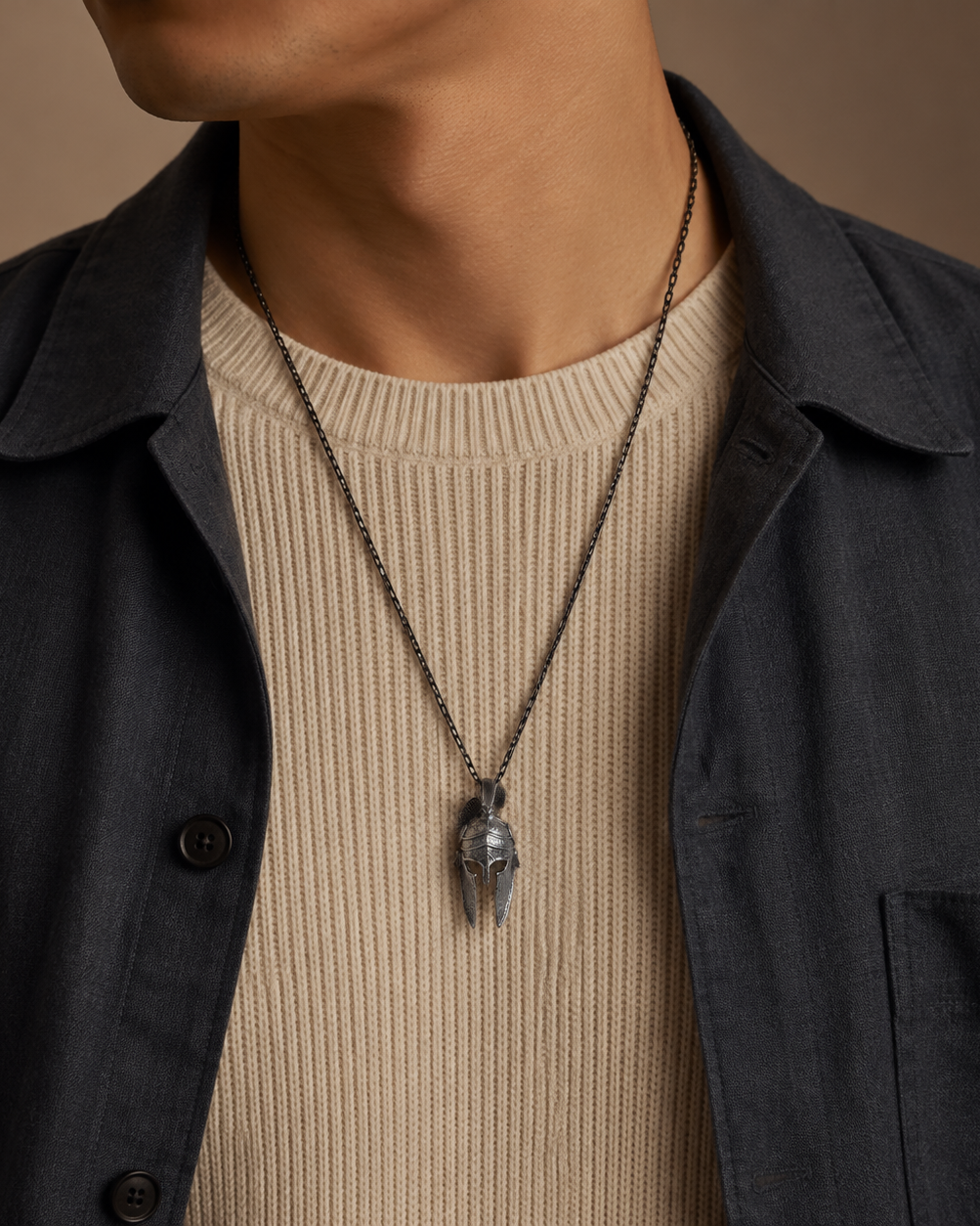 Spartan Helmet Talisman Pendant, held for scale