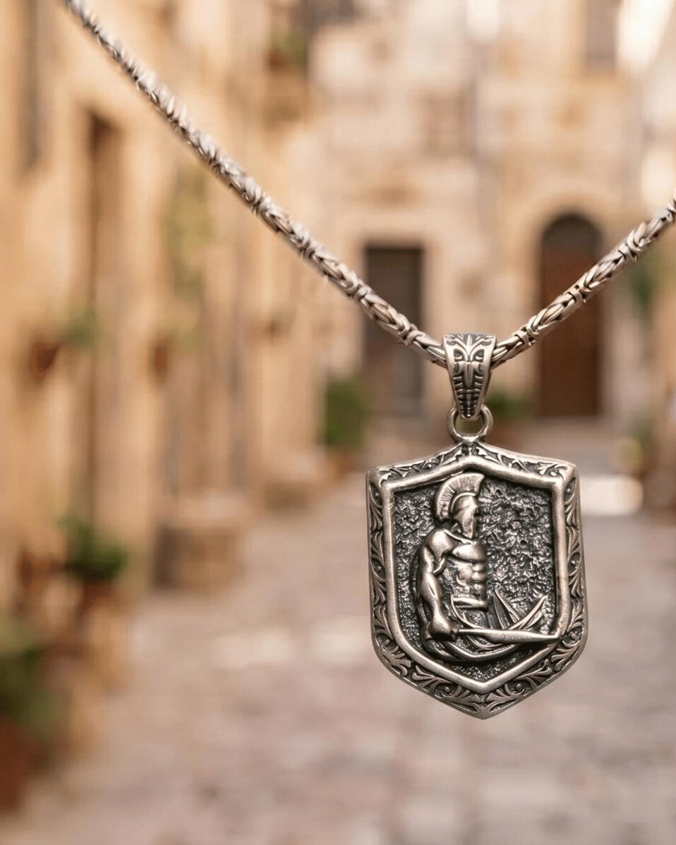 Spartan Shield & Sword Pendant, displayed on a dark surface