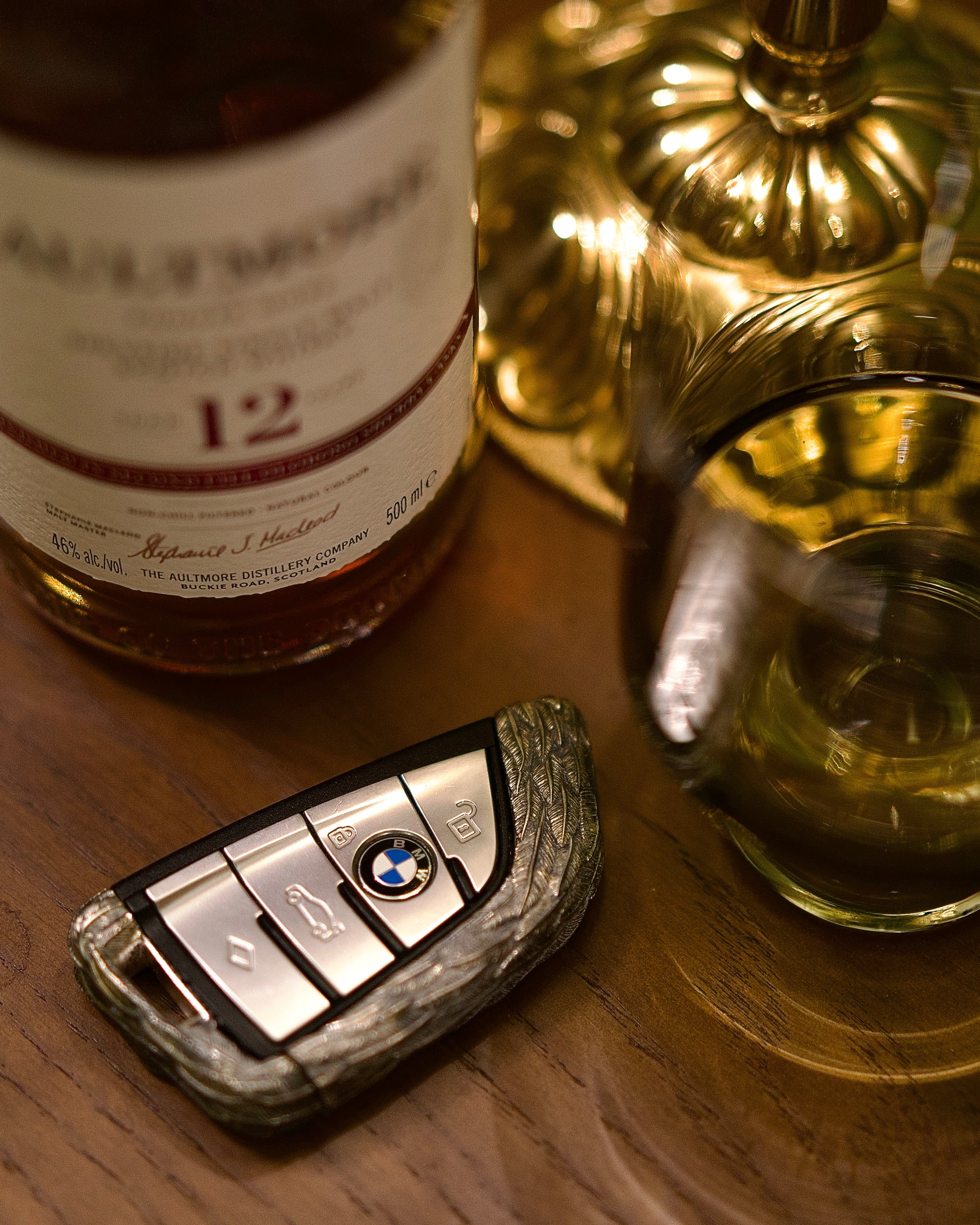 Sterling Silver BMW key case displayed on refined desk surface, evoking understated elegance