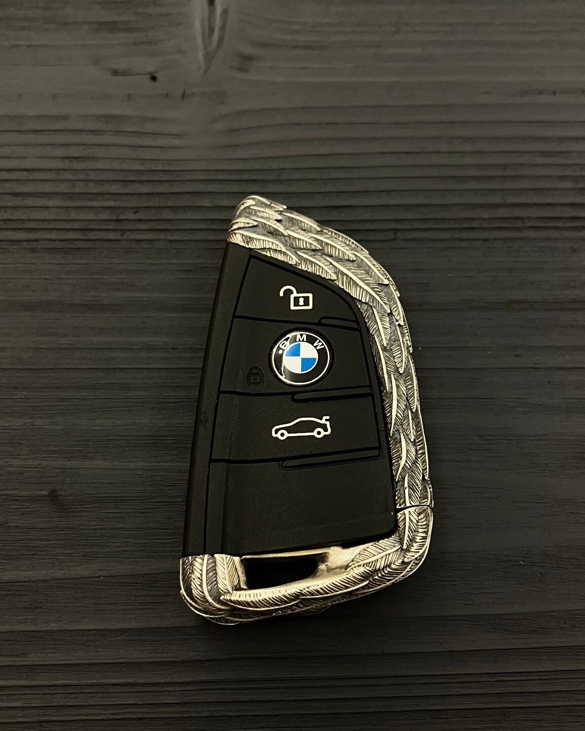 Back view showing continuous feather texture pattern on 925 Sterling Silver BMW key case