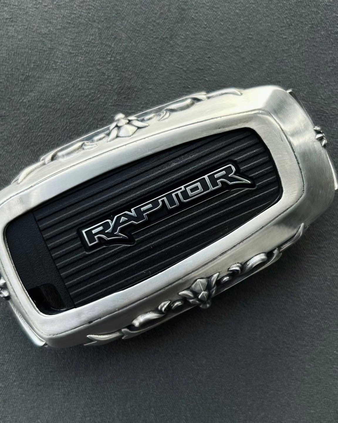 Top angle view of hand-finished Ford Bronco Raptor key case with oxidized accent details