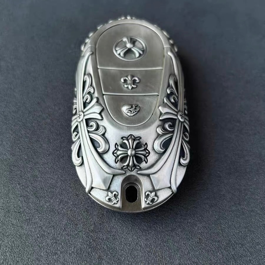 Sterling Silver Mercedes key case displayed with understated elegance on dark surface
