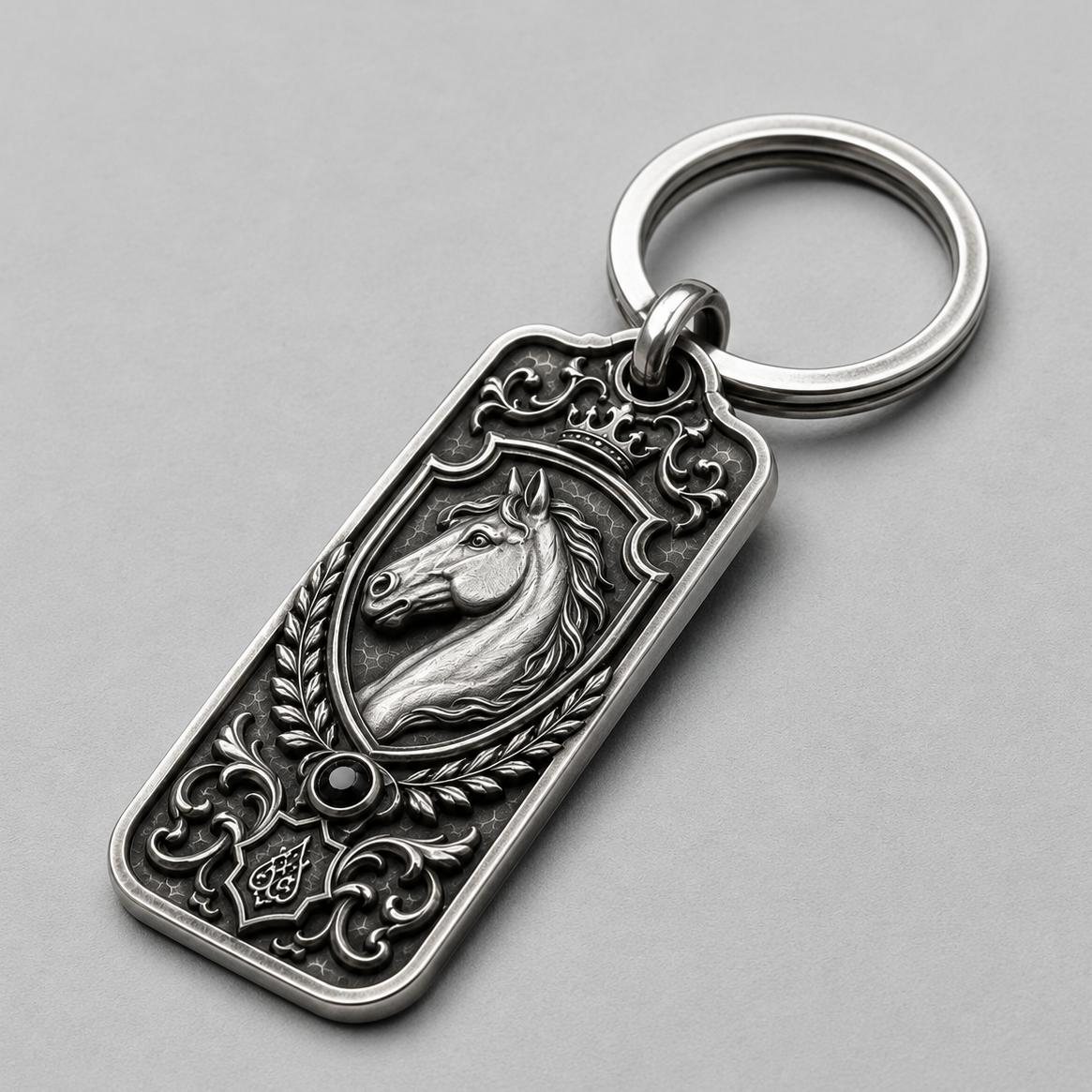 Equestrian Crest Personalized Key Tag, front view beside a car key