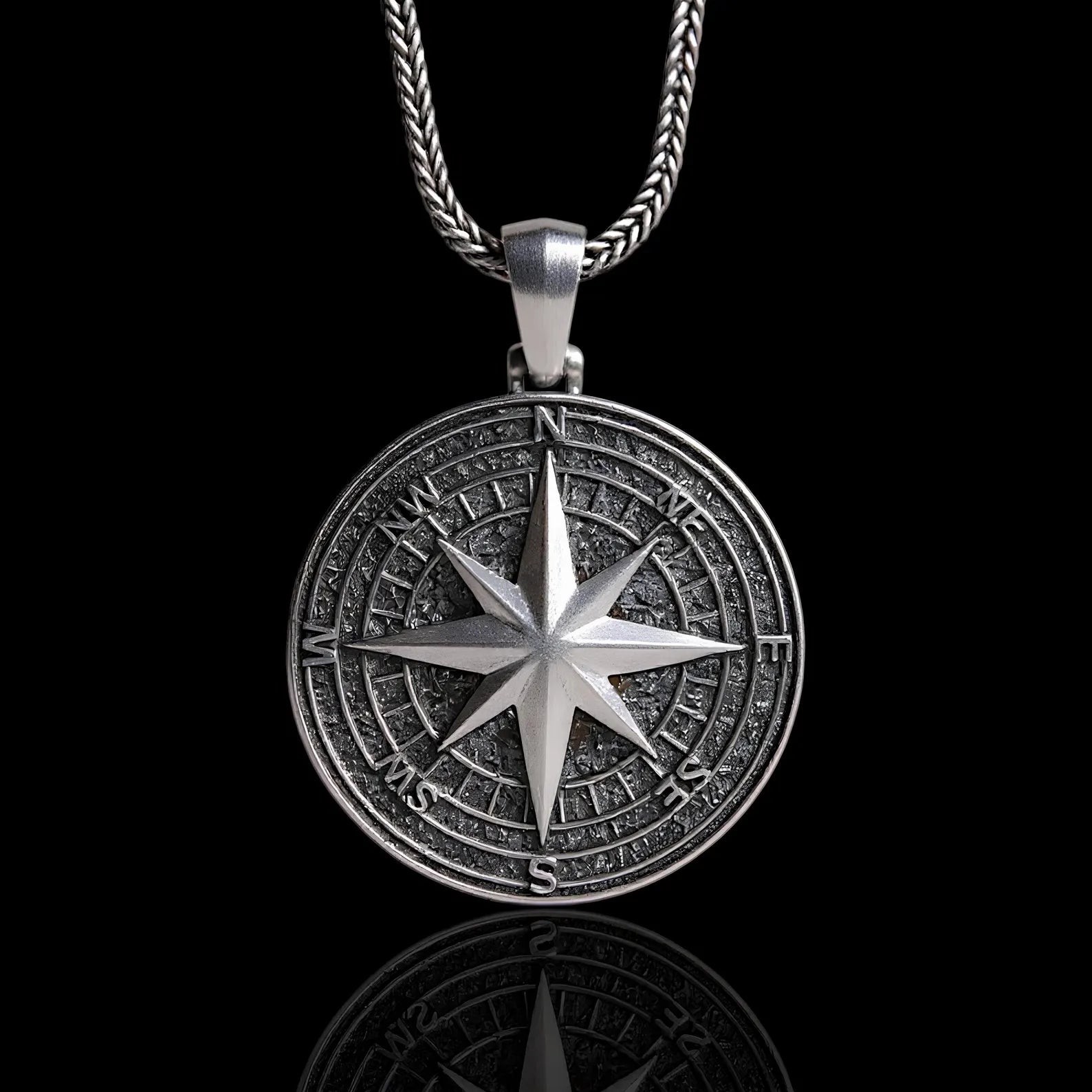 Engraved North Star Compass 925 Silver Necklace, front view beside a car key