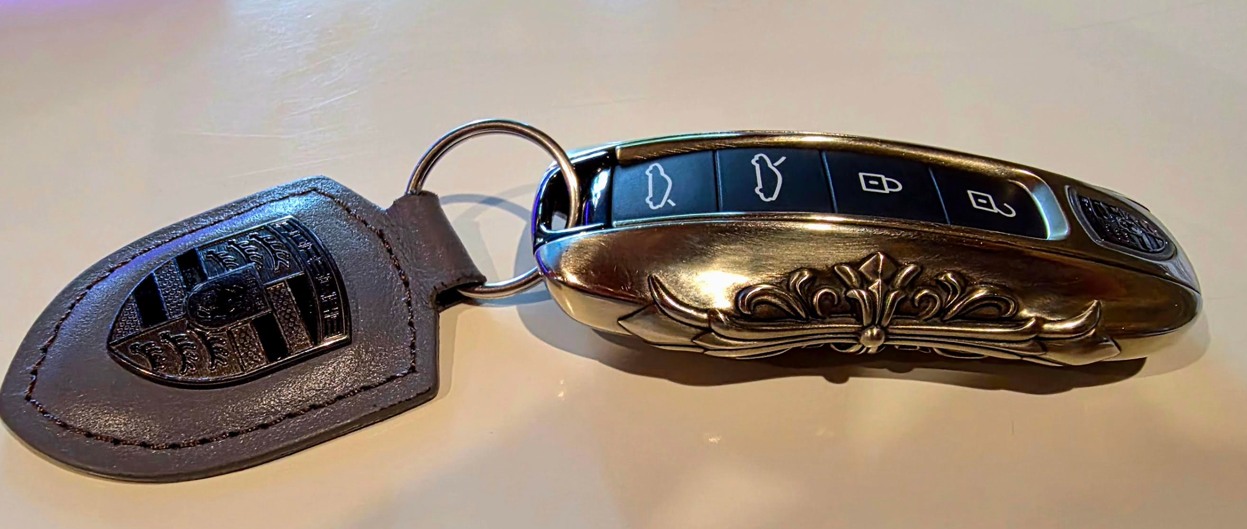 Customer photo of an IGNIS ARGENTUM key case showing fit and finish beside the original vehicle key