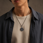 All-Seeing Eye Serpent Pendant, displayed on a dark surface