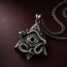 All-Seeing Eye Serpent Pendant, worn on a chain