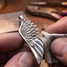 Angel Wing 925 Silver Pendant, displayed on a dark surface
