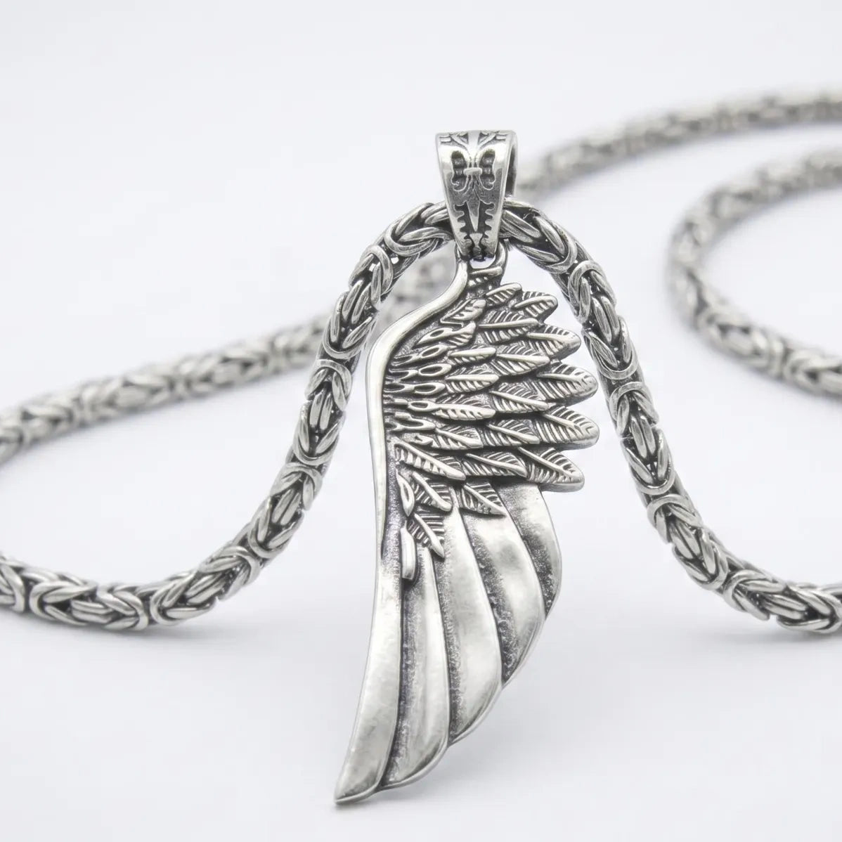 Angel Wing 925 Silver Pendant, held for scale