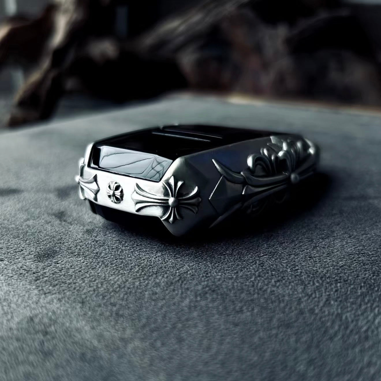 Aston Martin handcrafted sterling silver key case top-down view showcasing streamlined silhouette, solid silver edge engraving and precise fit for original key fob