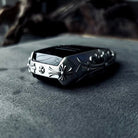 Aston Martin handcrafted sterling silver key case top-down view showcasing streamlined silhouette, solid silver edge engraving and precise fit for original key fob