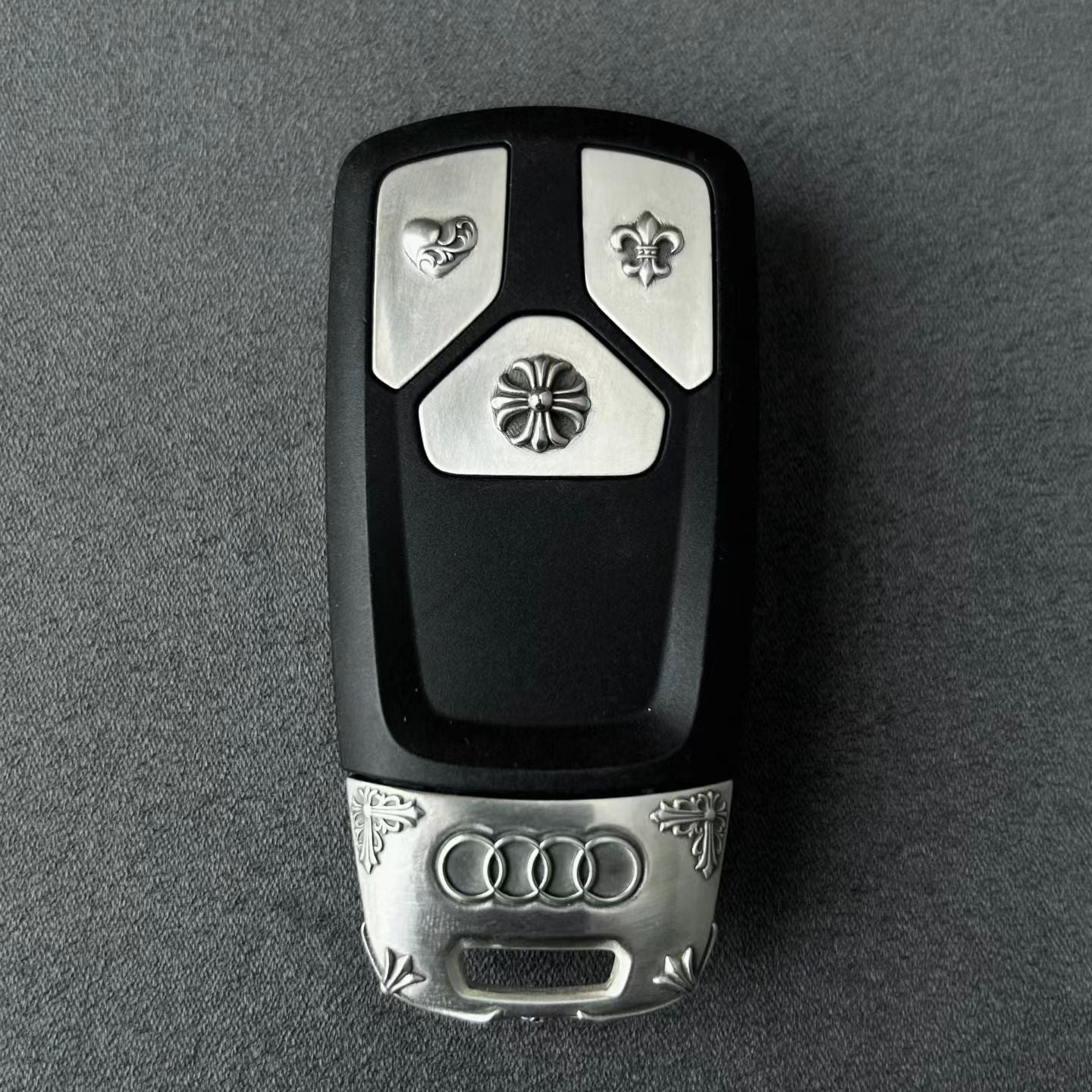 Audi Tri-Layout handcrafted key case Nickel Silver front view with precision engraved details