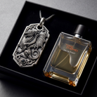 Bespoke dragon-motif key tag, displayed beside fragrance bottle