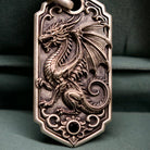 Bespoke dragon-motif key tag, dragon engraving close-up