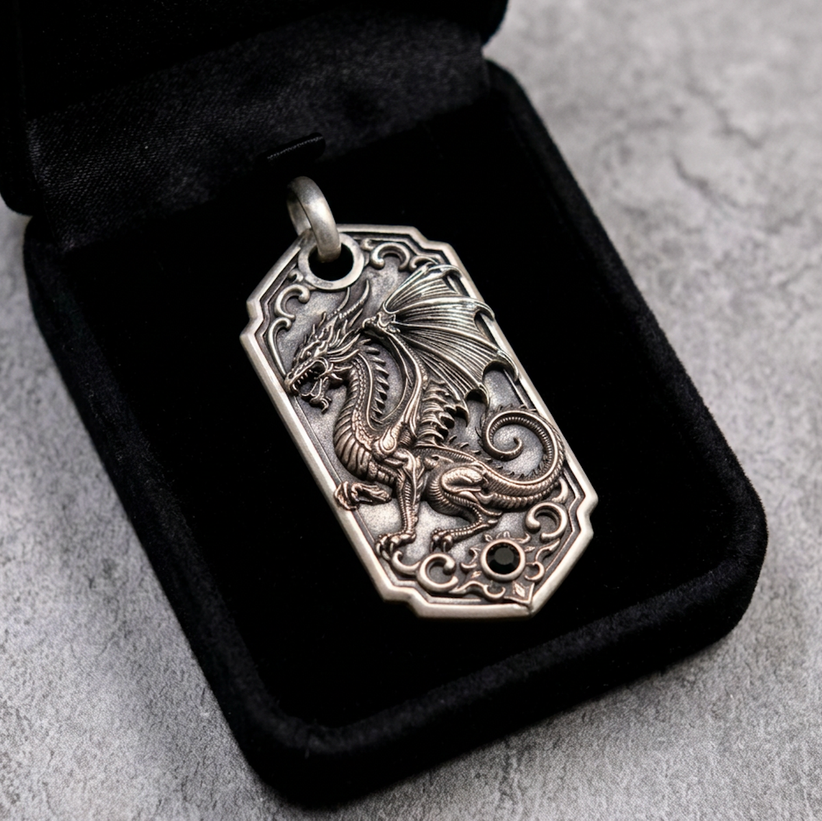 Bespoke dragon-motif key tag, presentation pouch view