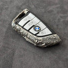 Side view showing the slim edge profile of the BMW cloud style sterling silver case, contrasting the raised engraved pattern against the matte background